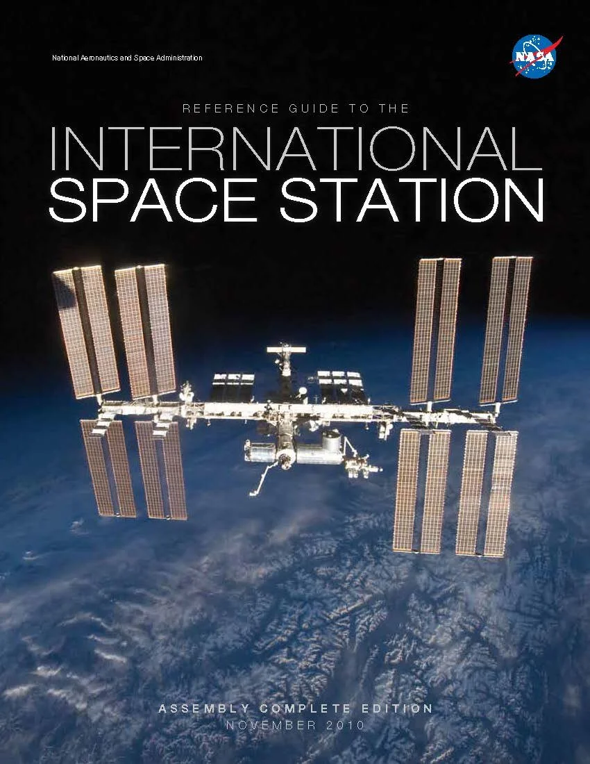 Cover of NASA's Reference Guide to the International Space Station, Assembly Complete Edition: the completed station photographed against Earth on a black field.